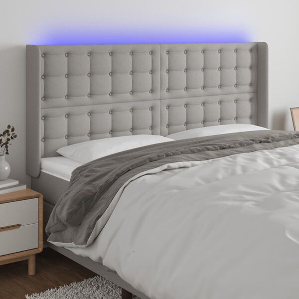 vidaXL Čelo postele s LED světle &scaron;ed&eacute; 163x16x118/128 cm textil