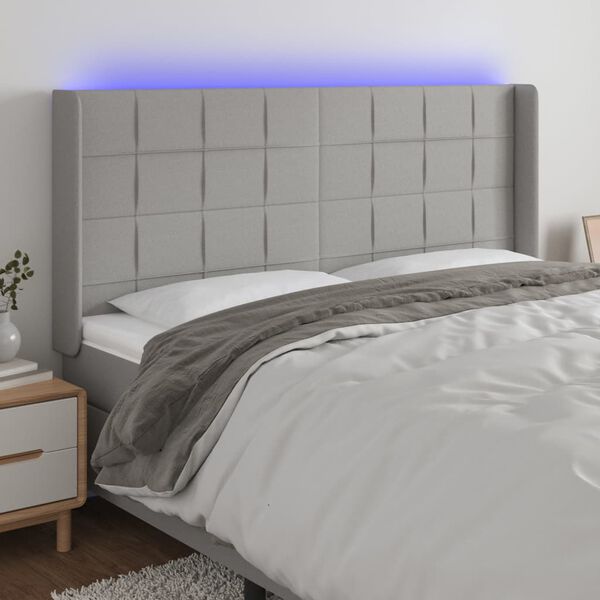 vidaXL Čelo postele s LED světle &scaron;ed&eacute; 163x16x118/128 cm textil