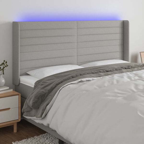 vidaXL Čelo postele s LED světle &scaron;ed&eacute; 203x16x118/128 cm textil