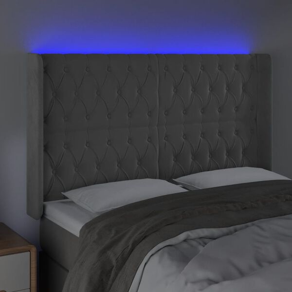 vidaXL Čelo postele s LED světle &scaron;ed&eacute; 147x16x118/128 cm samet