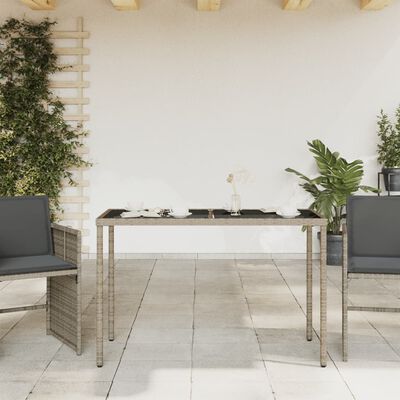 vidaXL Zahradní stůl se skleněnou deskou šedý 115x54x74 cm polyratan