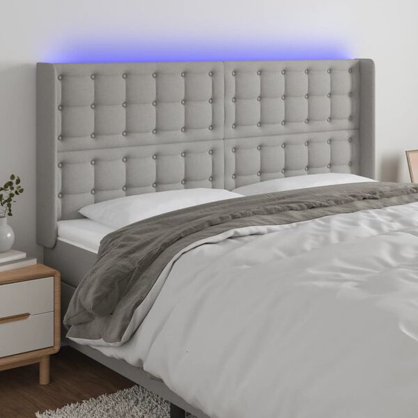 vidaXL Čelo postele s LED světle &scaron;ed&eacute; 203x16x118/128 cm textil