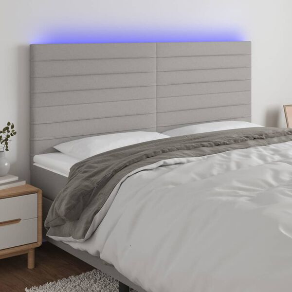 vidaXL Čelo postele s LED světle &scaron;ed&eacute; 200x5x118/128 cm textil
