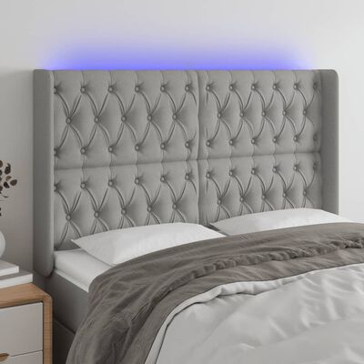 vidaXL Čelo postele s LED světle šedé 147x16x118/128 cm textil
