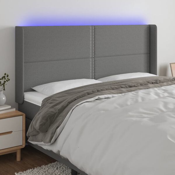 vidaXL Čelo postele s LED tmavě &scaron;ed&eacute; 163 x 16 x 118/128 cm textil
