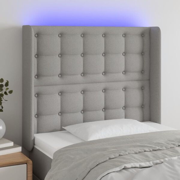 vidaXL Čelo postele s LED světle &scaron;ed&eacute; 83 x 16 x 118/128 cm textil