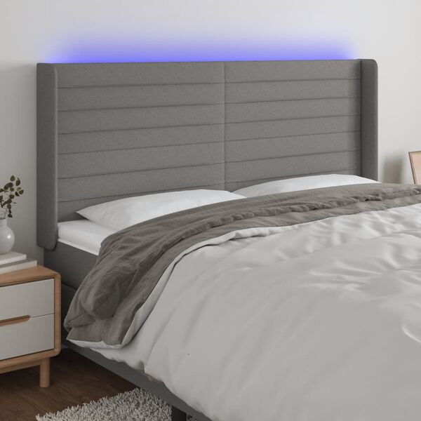vidaXL Čelo postele s LED tmavě &scaron;ed&eacute; 163 x 16 x 118/128 cm textil