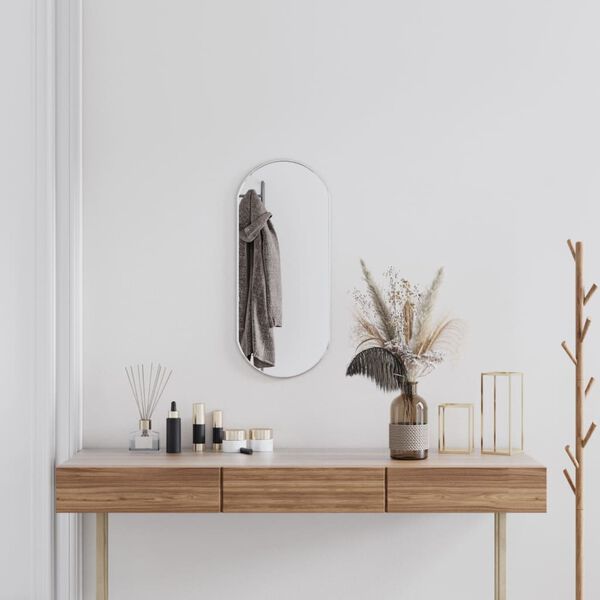 vidaXL N&aacute;stěnn&eacute; zrcadlo stř&iacute;brn&eacute; 70x30 cm ov&aacute;ln&eacute;