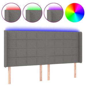 vidaXL Čelo postele s LED tmavě &scaron;ed&eacute; 163 x 16 x 118/128 cm textil