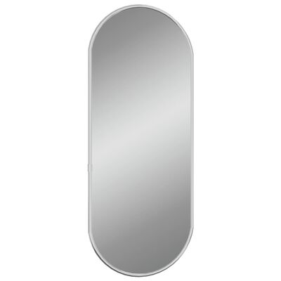 vidaXL Nástěnné zrcadlo stříbrné 50x20 cm oválné