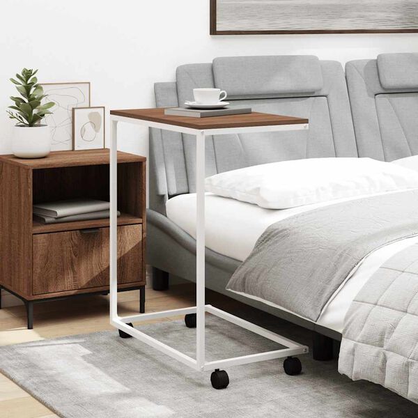 vidaXL Odkl&aacute;dac&iacute; stolek s kolečky b&iacute;l&yacute; 55x35x70 cm kompozitn&iacute; dřevo