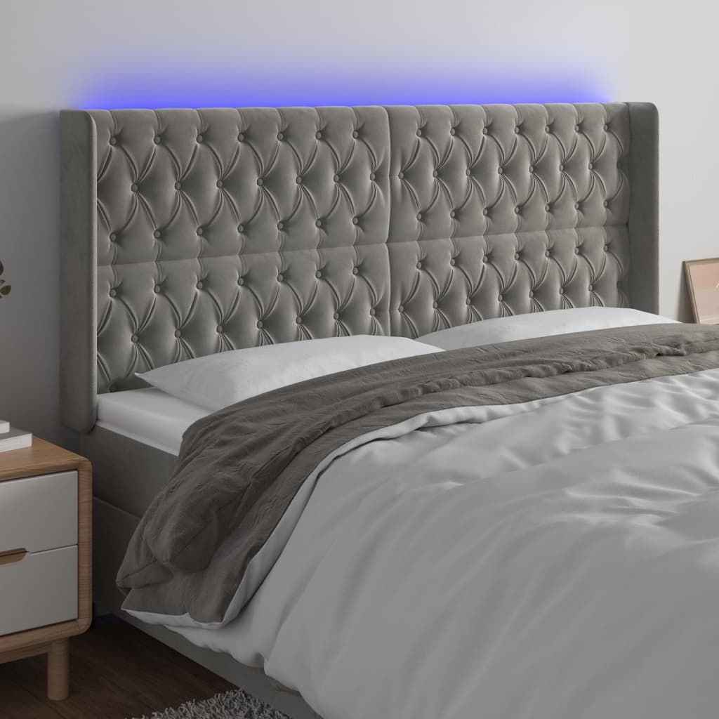 vidaXL Čelo postele s LED světle šedé 203 x 16 x 118/128 cm samet