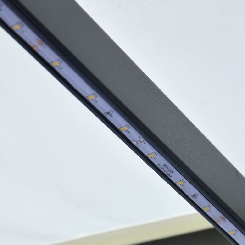 vidaXL Ručně zatahovací markýza s LED světlem 600 x 300 cm krémová