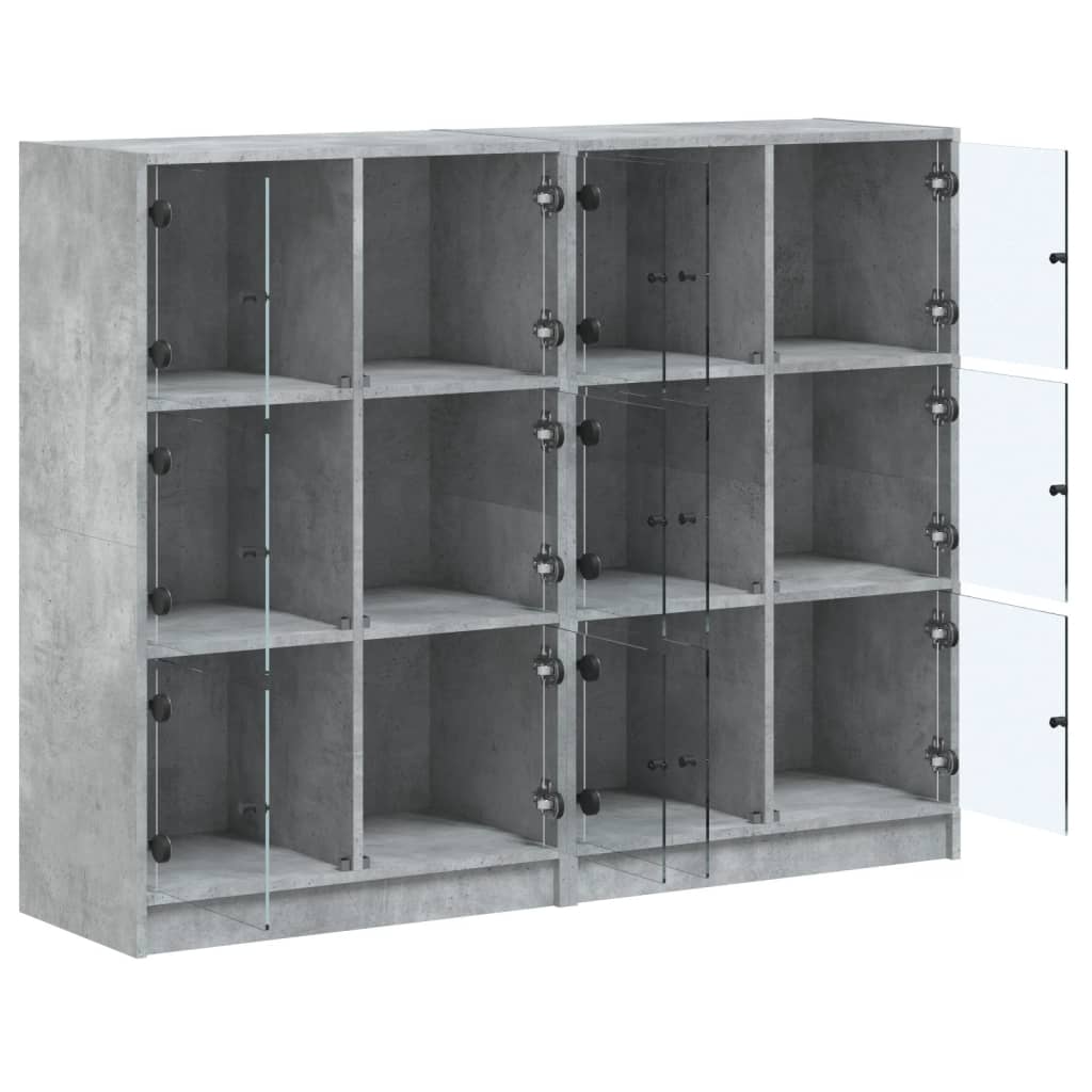 vidaXL Knihovna s dvířky betonově šedá 136x37x109 cm kompozitní dřevo